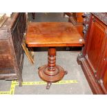 A 19th Century mahogany occasional table, the square top raised on a turned baluster column, the