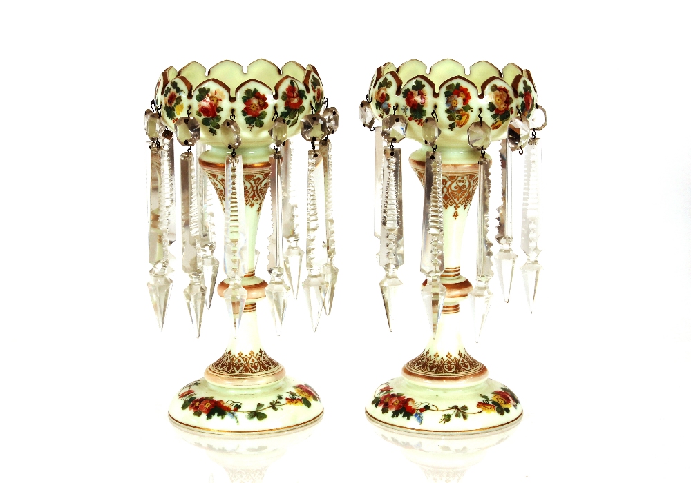 A pair of Victorian pale green opaque glass lustre vases, having painted foliate spray decoration