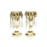 A pair of Victorian pale green opaque glass lustre vases, having painted foliate spray decoration