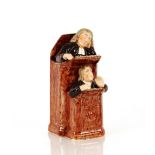 A Victorian Staffordshire preaching figure group, "The Vicar and Moses", 23cm high