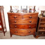 A 19th Century mahogany bow fronted chest, of two short and three long drawers raised on a shaped