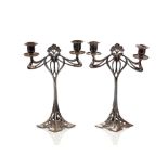 A pair of Art Nouveau plated WMF twin branch candelabra, with pierced foliate decoration, 30cm high