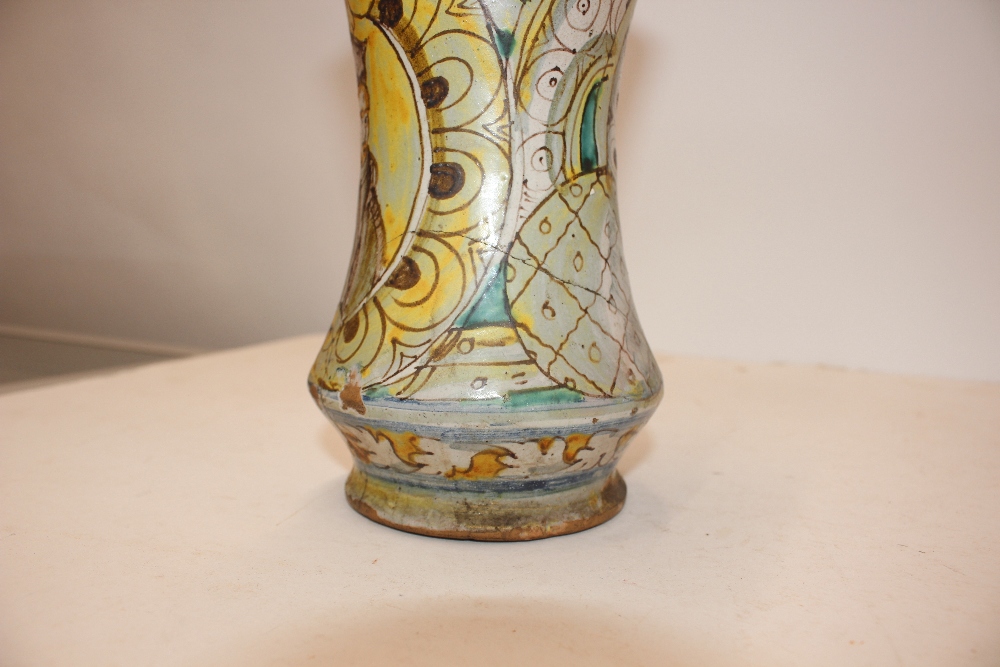 A glazed earthenware albarello, decorated with an oval panel of a priest surrounded by foliate - Image 4 of 8