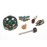 A white metal and malachite set circular brooch;  an 800 mark owl brooch set turquoise stones; a 9ct