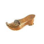 An early 19th Century French gilt metal ladies necessaire box, in the form of a shoe, in the