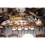 A large mahogany extending dining table, in the Victorian style fitted with four extra leaves,