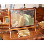 A late 19th Century mahogany swing frame toilet mirror, bearing label "Designed and Executed by