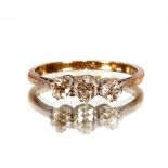 An 18ct gold and diamond three stone diamond ring, total weight 2gms