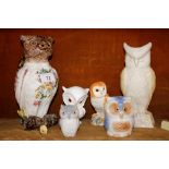 A continental pottery owl jug, (AF); a Belleek porcelain vase in the form of an owl; a Beswick study