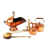 Two Victorian copper kettles; a Victorian copper coal helmet; a brass chestnut roaster; two toasting