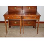 A pair of mahogany and satin wood cross banded lamp tables, fitted single drawers, raised on