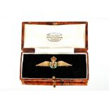 A 9ct gold and enamel RAF wings brooch