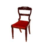 A set of six 19th Century carved mahogany dining chairs, with upholstered drop in seats, raised on