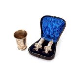 A pair of Edwardian silver peppers, in fitted box by Walker & hall, Sheffield 1901; and a Dutch