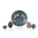 A Japanese cloisonné plate, decorate quail amongst foliage; two miniature teapots; a vase and cover;