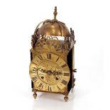 A brass lantern clock, with eight day movement striking on a bell