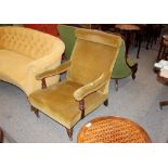 A late Victorian walnut framed deep seated easy chair, upholstered in old gold Dralon raised on