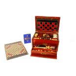 A late Victorian games compendium, comprising turned wooden chess and draughts set, bone and ebony