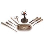 A quantity of various silver mounted manicure items; a small silver pin tray; and a white metal;