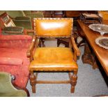 A set of twelve Tudor style bespoke oak dining chairs, with leather upholstered seats and studded