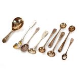 A George III silver caddy spoon, London 1809, and various silver condiment spoons