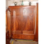 An Art Deco mahogany and pine press cupboard, hand written label to the interior "Token Hand Made