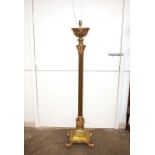 A good quality brass and copper Corinthian column standard lamp, raised on bold claw supports