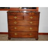 A 19th Century mahogany chest, fitted two short and three long drawers raised on bun feet