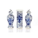 A pair of 19th Century Chinese blue and white baluster vases, decorated with figures, four character