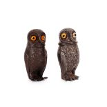 A pair of spelter owl salt and pepper pots, 8cm high