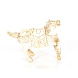 A carved ivory figure of a war horse, 9cm long, 8cm high