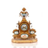 A 19th Century gilded and Sevres style porcelain panel decorated French mantel clock, surmounted