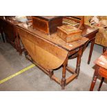 An 18th Century oak gate leg dining table, fitted with a single end drawer, raised on turned