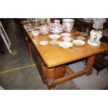 A bespoke craftsman made light oak refectory dining table, the planked top raised on bold baluster