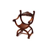 A carved walnut Glastonbury type chair, the scrolled back with beast terminals, acanthus leaf