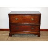 An antique oak chest, converted to a coffer, dummy drawer and single drawer below, the hinged lid