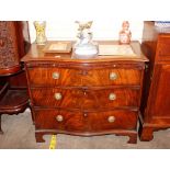 A 19th Century mahogany serpentine fronted chest, fitted brushing slide and three long graduated