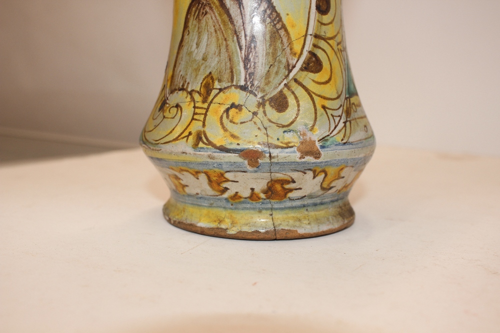 A glazed earthenware albarello, decorated with an oval panel of a priest surrounded by foliate - Image 6 of 8