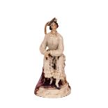 A 19th Century porcelain figure, depicting a seated maiden in brightly coloured pantaloons and cap