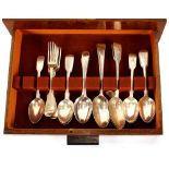 An oak cutlery canteen and contents, of various Fiddle pattern and Old English pattern flat ware,