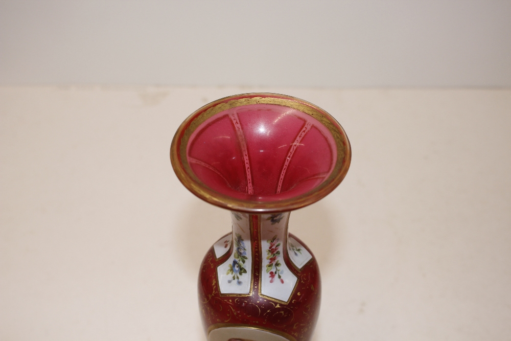 A 19th Century ruby and overlaid glass baluster vase, with profuse floral decoration, 29cm high; a - Image 2 of 12