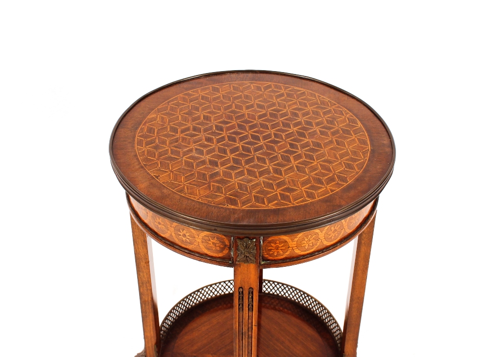 A 20th Century French parquetry decorated two tier occasional table, raised on square columns and - Image 2 of 2