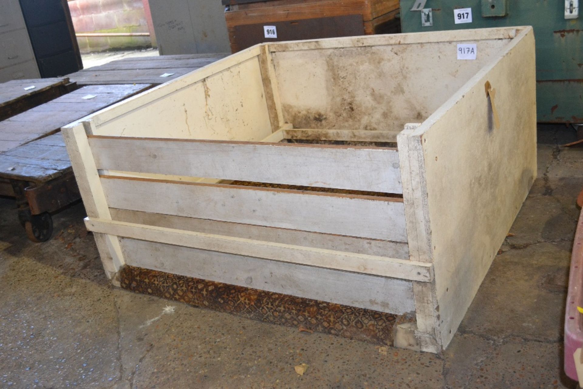 Large whelping box with safety side bars.