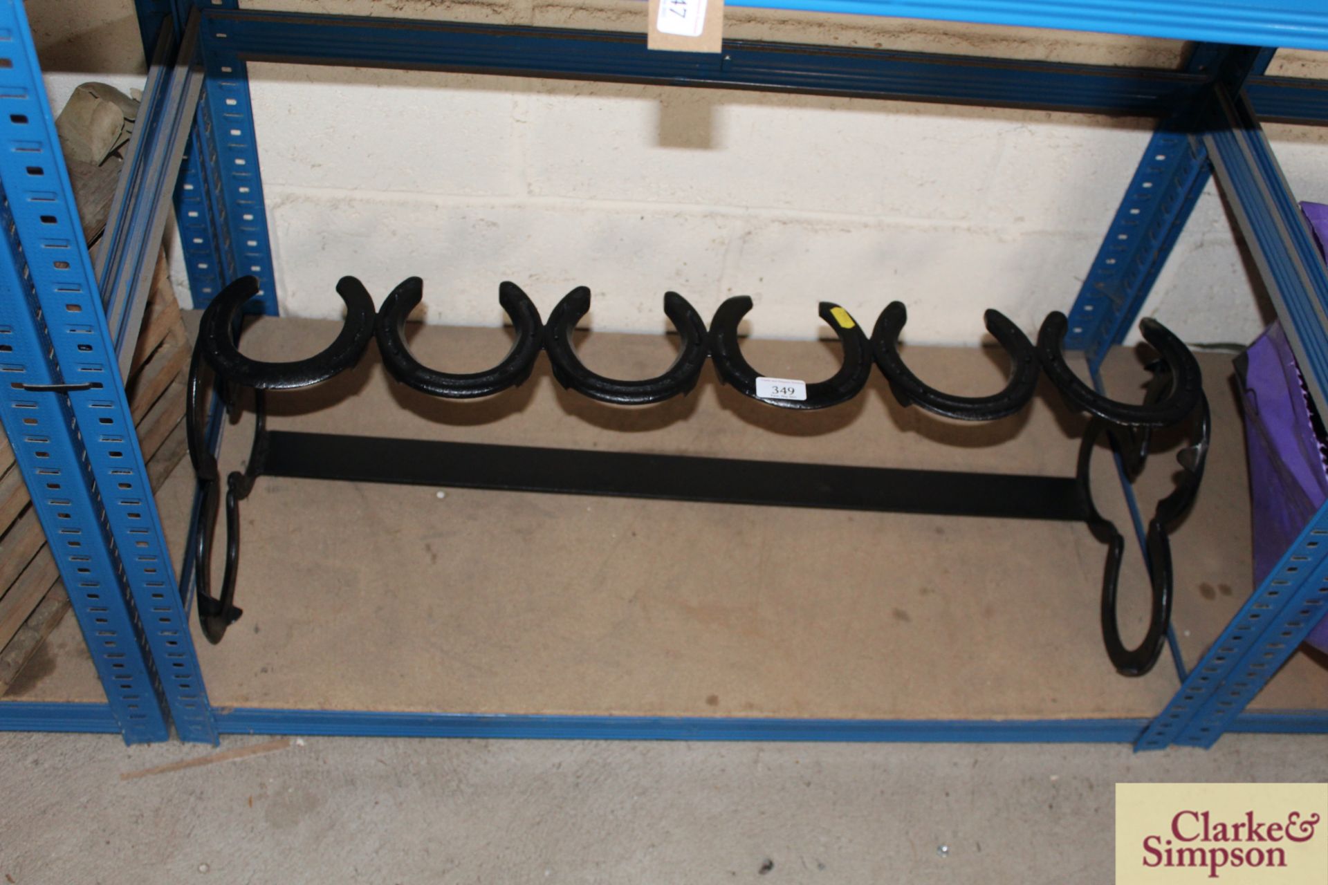 Horse shoe boot rack.