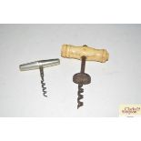 A bone handled corkscrew and a patent folding cork