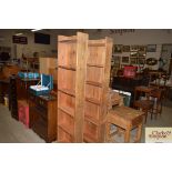 A pair of pine open fronted bookshelves
