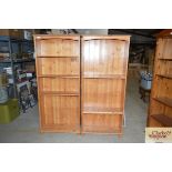 A pair of stripped pine open fronted bookcases