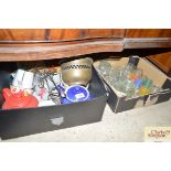 A box containing various teapots; and another box