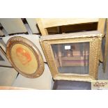 A decorative gilt framed bevel edged wall mirror;