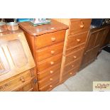 A modern pine serpentine fronted chest fitted six